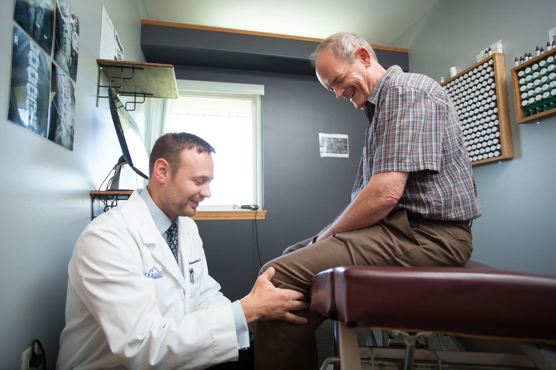A clinician examining a knee